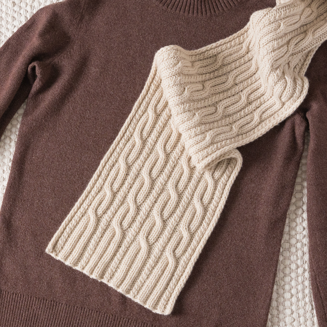 Knitted cable scarf.
