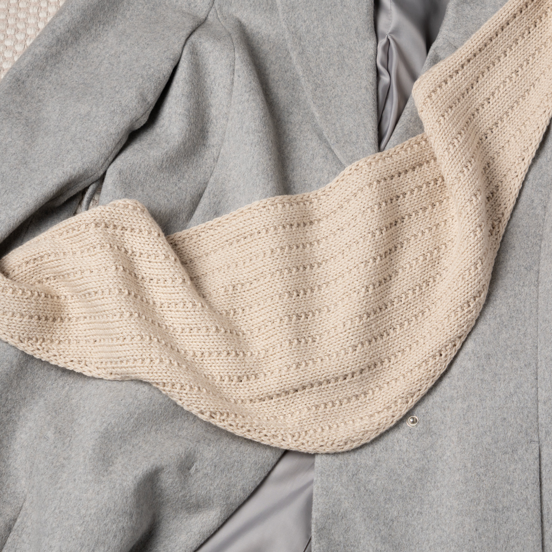 Knitted triangle scarf.