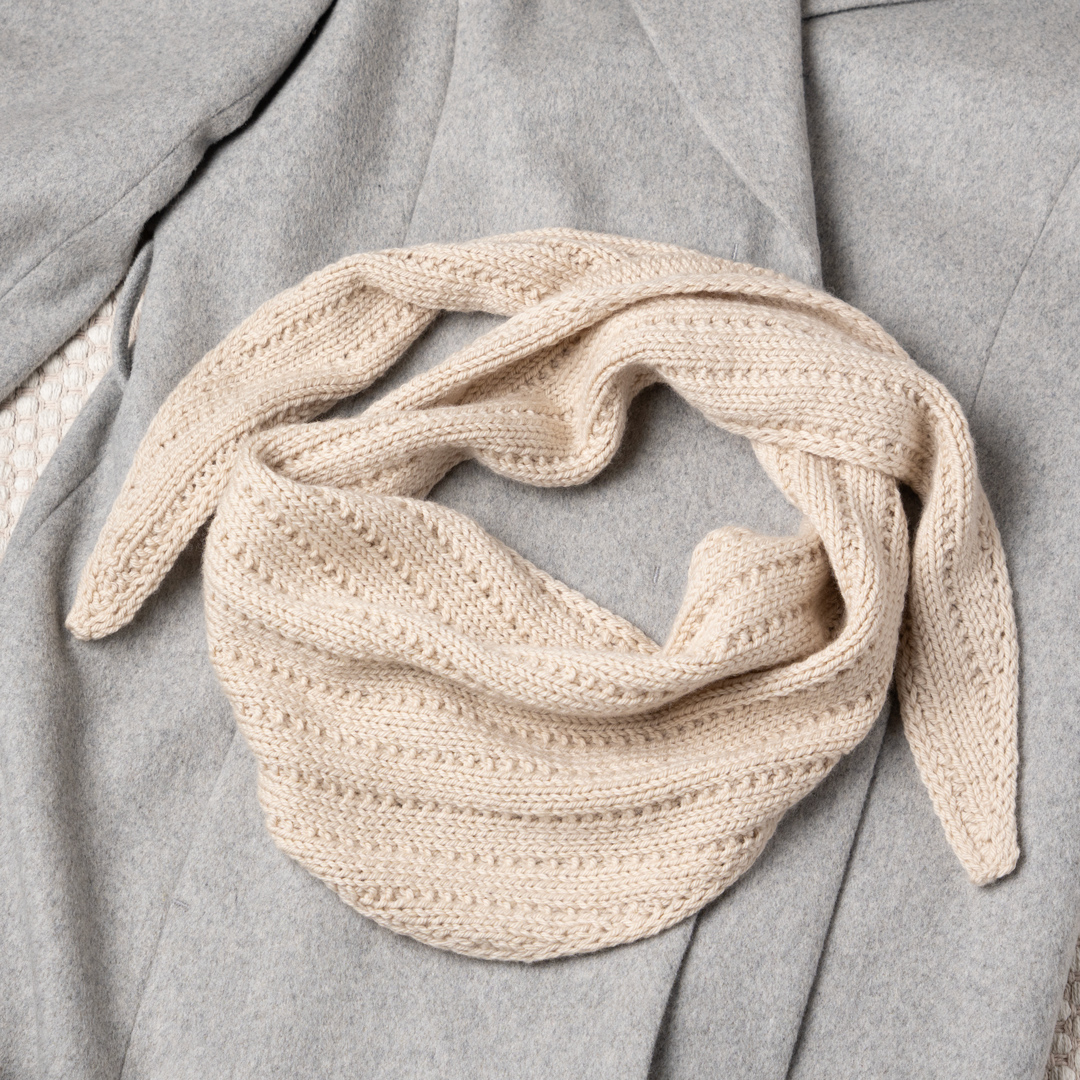 Knitted triangle scarf.