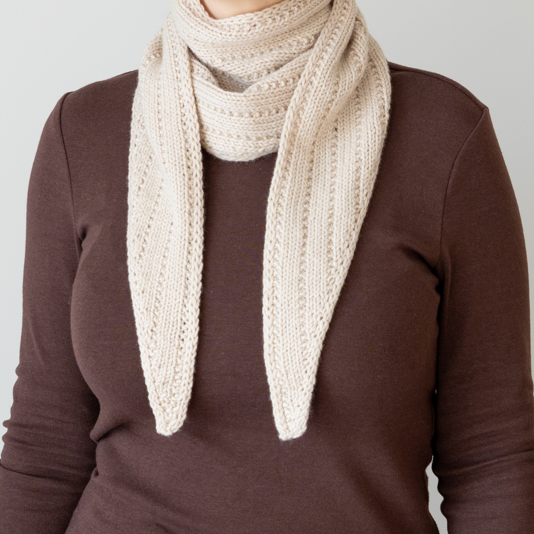 Knitted triangle scarf.